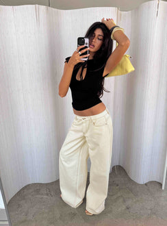 Showcasing the Ramos Low Rise Wide Leg Jeans Cream in womens jeans with low-rise waist front view of model wearing Princess Polly