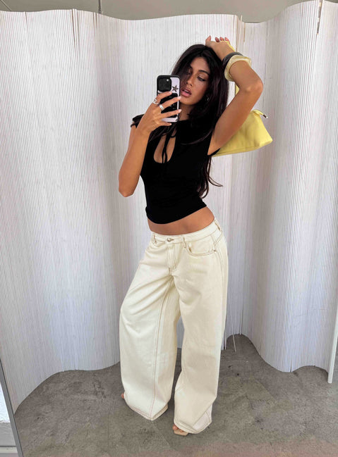 Showcasing the Ramos Low Rise Wide Leg Jeans Cream in womens jeans with low-rise waist front view of model wearing Princess Polly