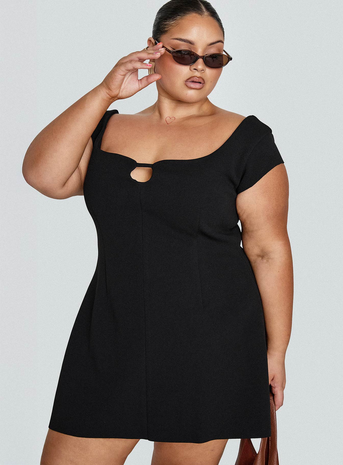 side view of model wearing Princess Polly Sylvette Mini Dress Black Curve Scoop Neck 