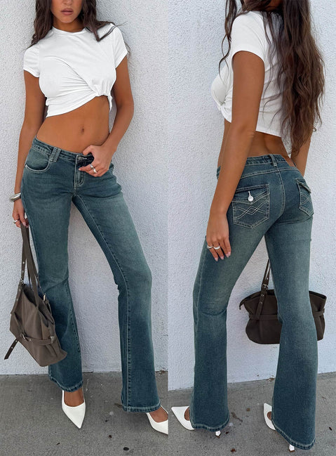 Showcasing the Clynee Ultra Low Rise Bootleg Jeans Dirty Blue in womens-jeans with low-rise waist front view of model wearing Princess Polly