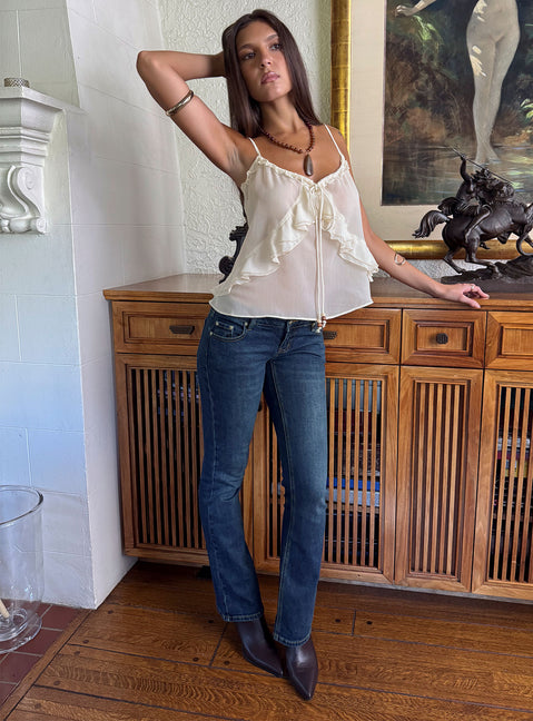 Showcasing Naketa Ultra Low Rise Bootleg Jeans Mid Blue Wash in womens-jeans with low-rise styling front view of model wearing Princess Polly