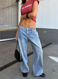 Showcasing Ellanor Low Rise Slouch Denim Jean Washed Mid Blue Wash Petite womens-jeans front view of model wearing Princess Polly