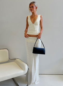 Showcasing the Zespri Jersey Maxi Skirt Cream Polka Dot womens-skirts featuring maxi length side view of model wearing Princess Polly