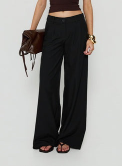 Showcasing the Archer Mid Rise Baggy Pants Black in womens-regular-pants with pleated details front view of model wearing Princess Polly
