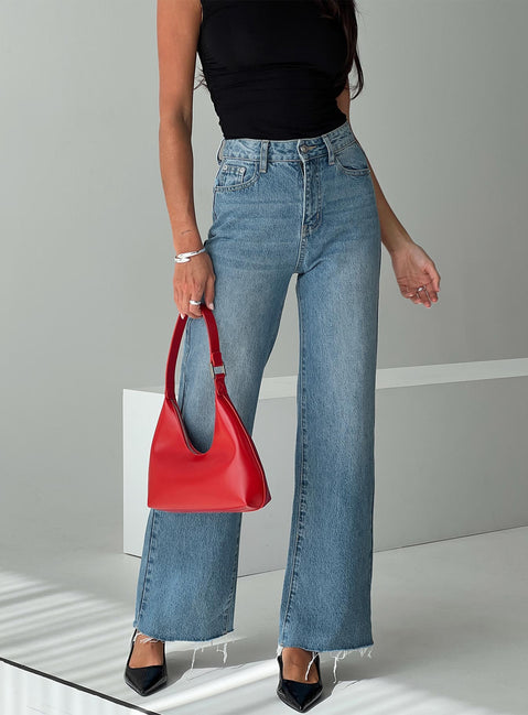 back view of model wearing Princess Polly Henesey Raw Hem Jeans Mid Wash Tall High Waisted 