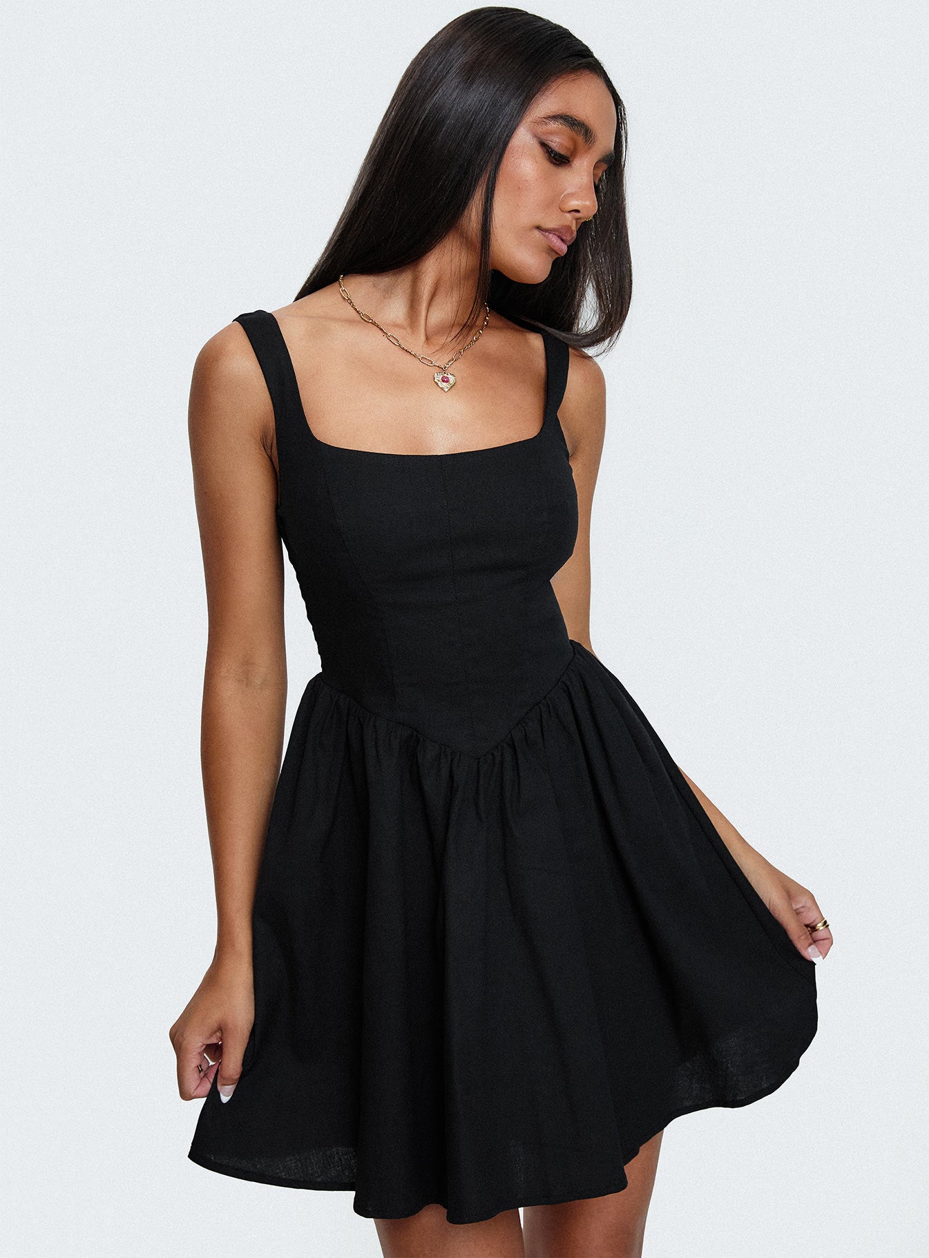 side view of model wearing Princess Polly Martie Mini Dress Black Square Neck 