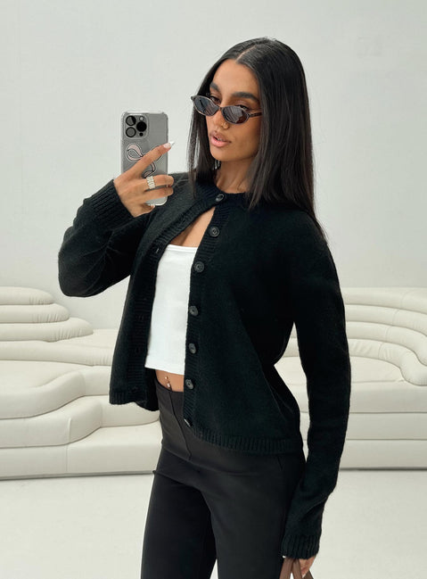 side view of model wearing Princess Polly Denmark Cardigan Black Cropped 
