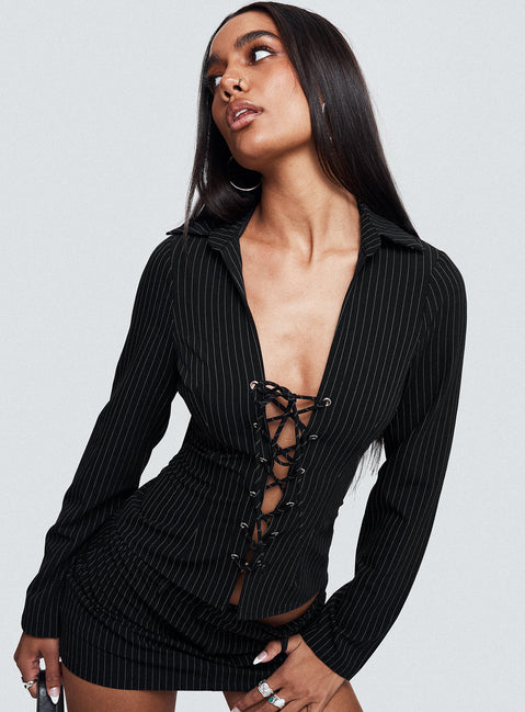back view of model wearing Princess Polly Feminique Tie Up Long Sleeve Top Black Stripe Full Sleeves Plunger 