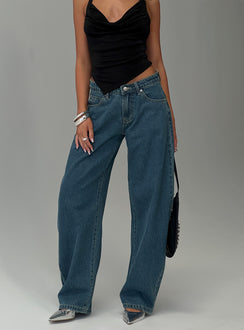 back view of model wearing Princess Polly Juda Mid Rise Barrel Leg Jeans Mid Blue Wash High Waisted Jeans 