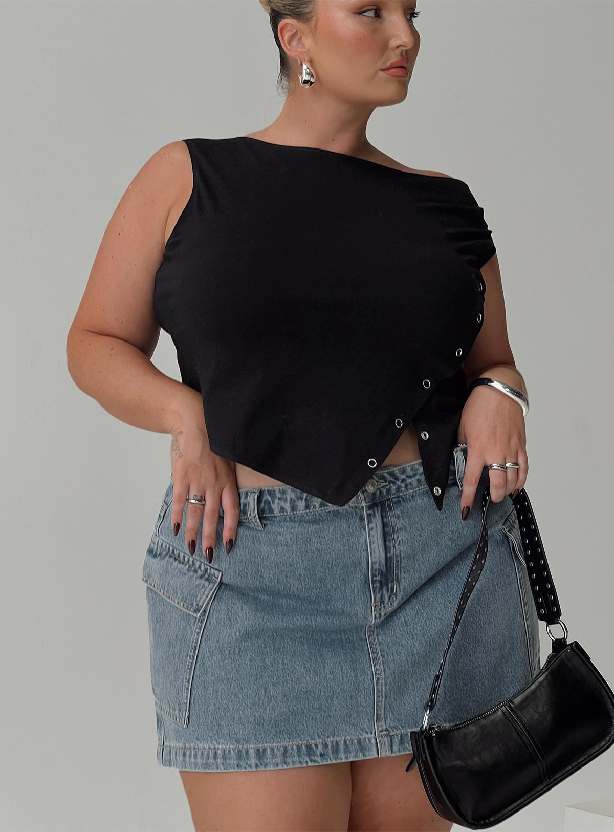 front view of model wearing Princess Polly Karre Off The Shoulder Top Black Curve Sleeveless Asymmetric Neckline 