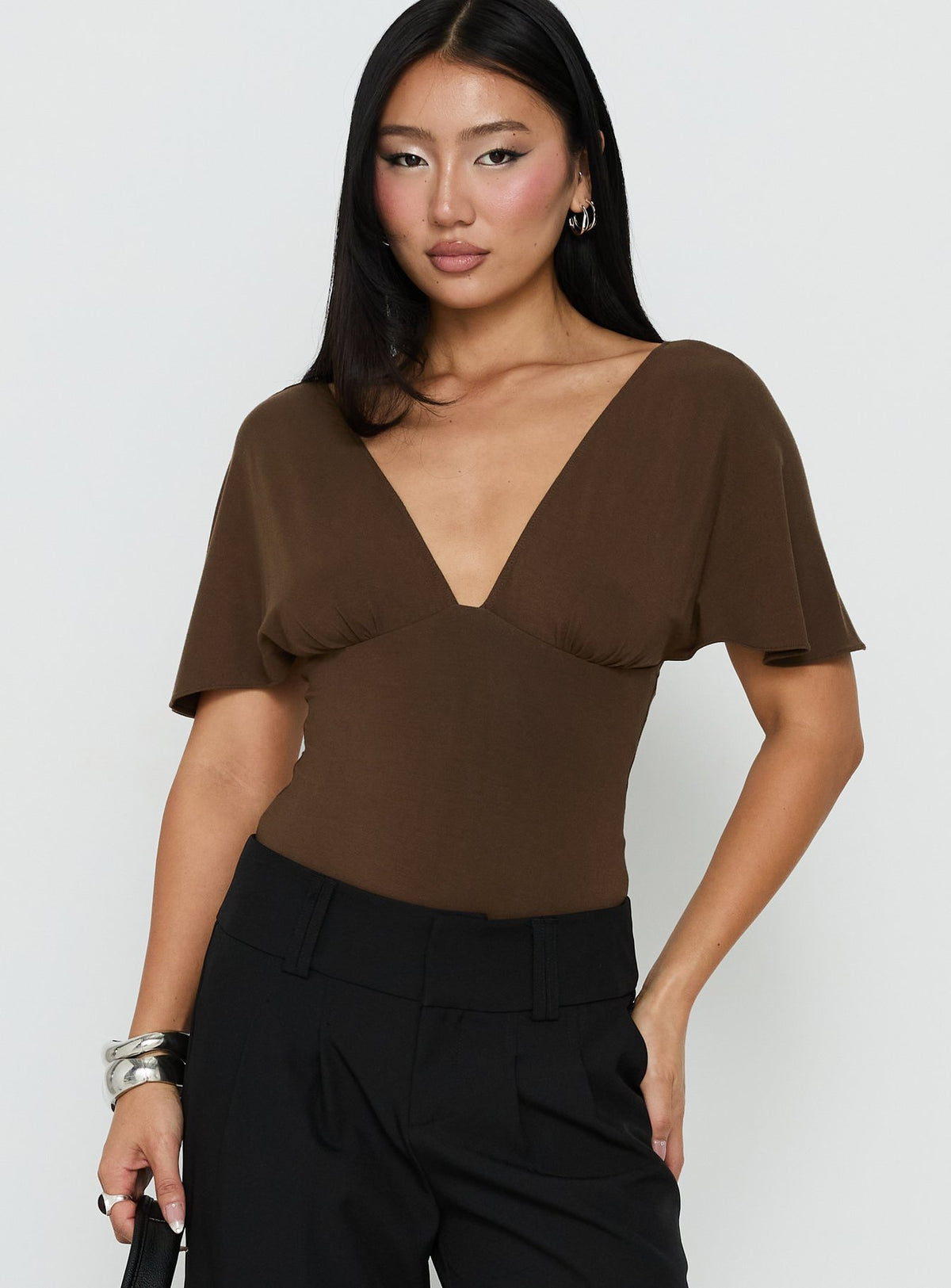 Discover the Yevenna Batwing Plunge Bodysuit Chocolate womens-bodysuit with short sleeves front view of model wearing Princess Polly