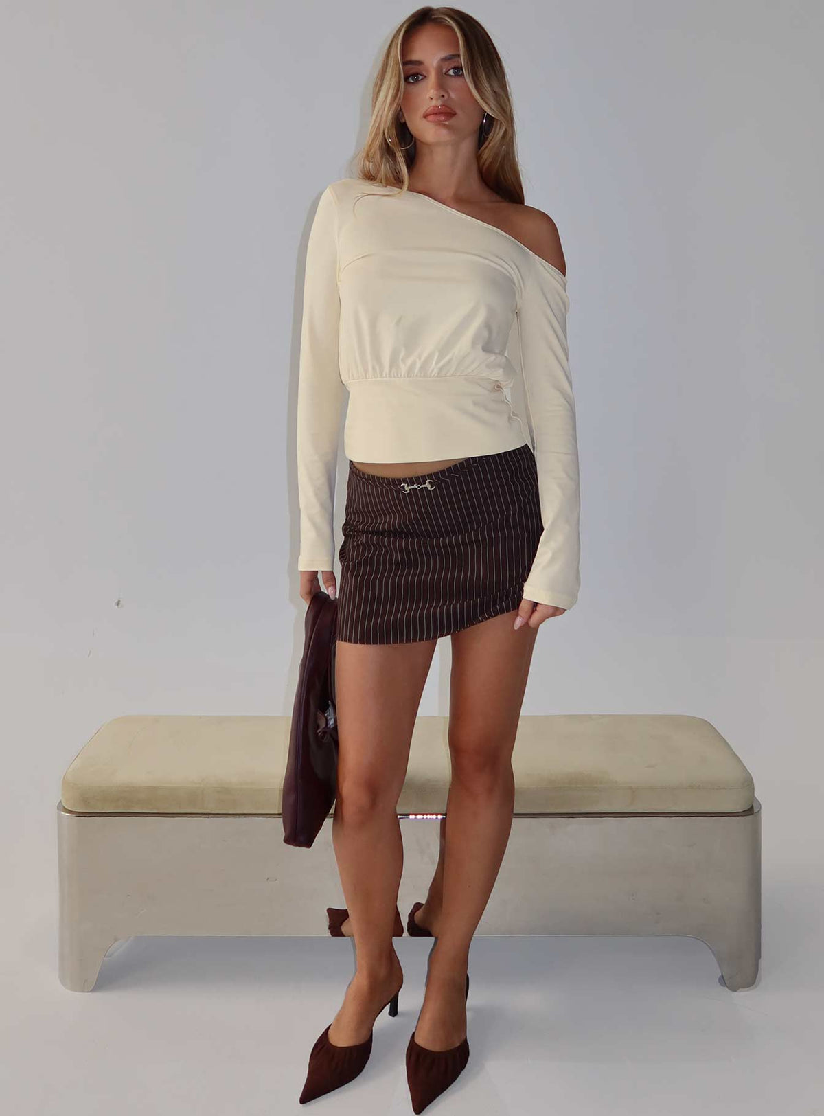   front view of model wearing Princess Polly Yellena Buckle Mini Skirt Brown Pinstripe Mini Skirts Skirts 