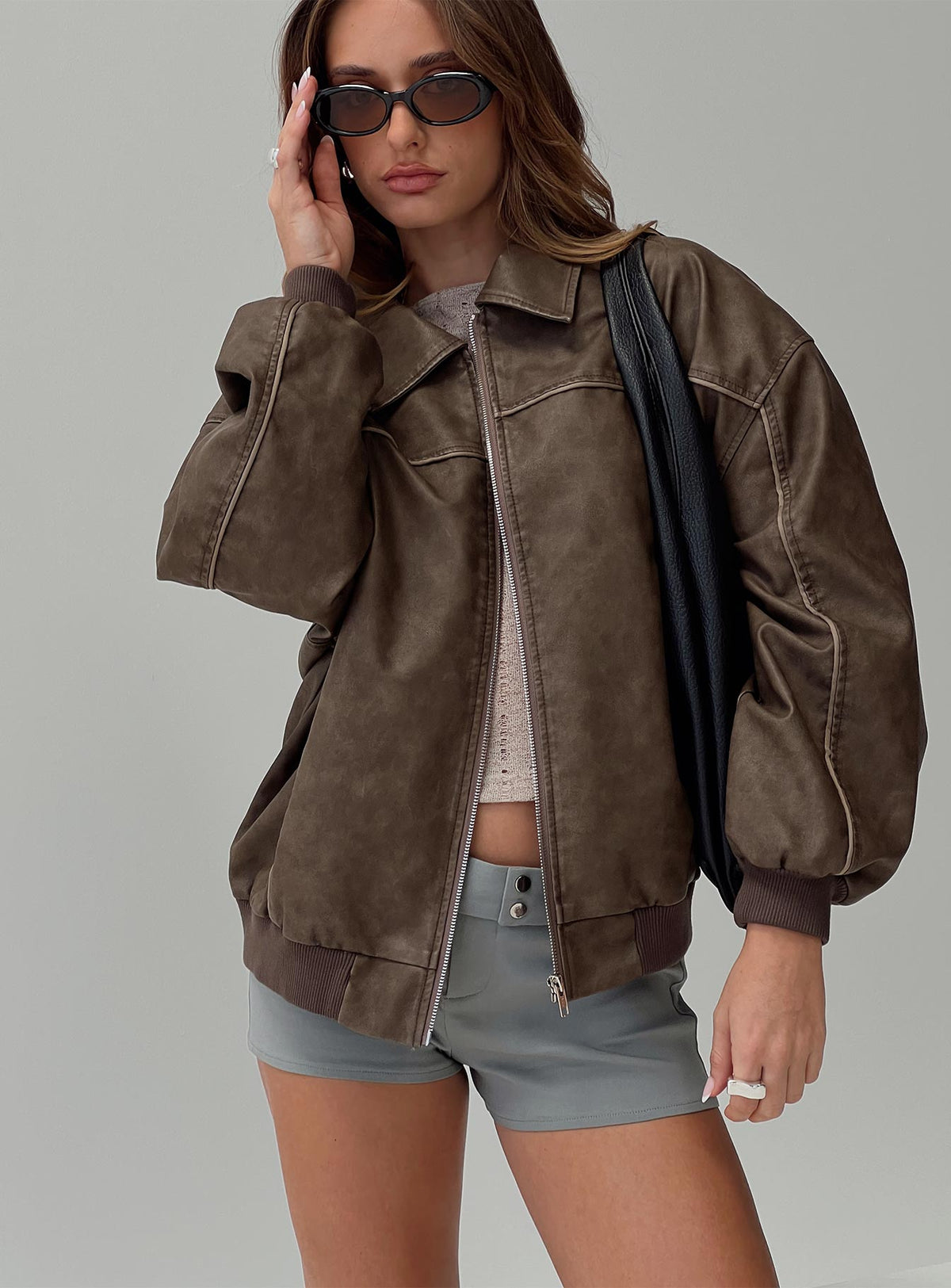 Faux leather bomber jacket  Classic collar, ribbed waistband and cuffs, zip front fastening, twin hip pockets  Non-stretch, fully lined 