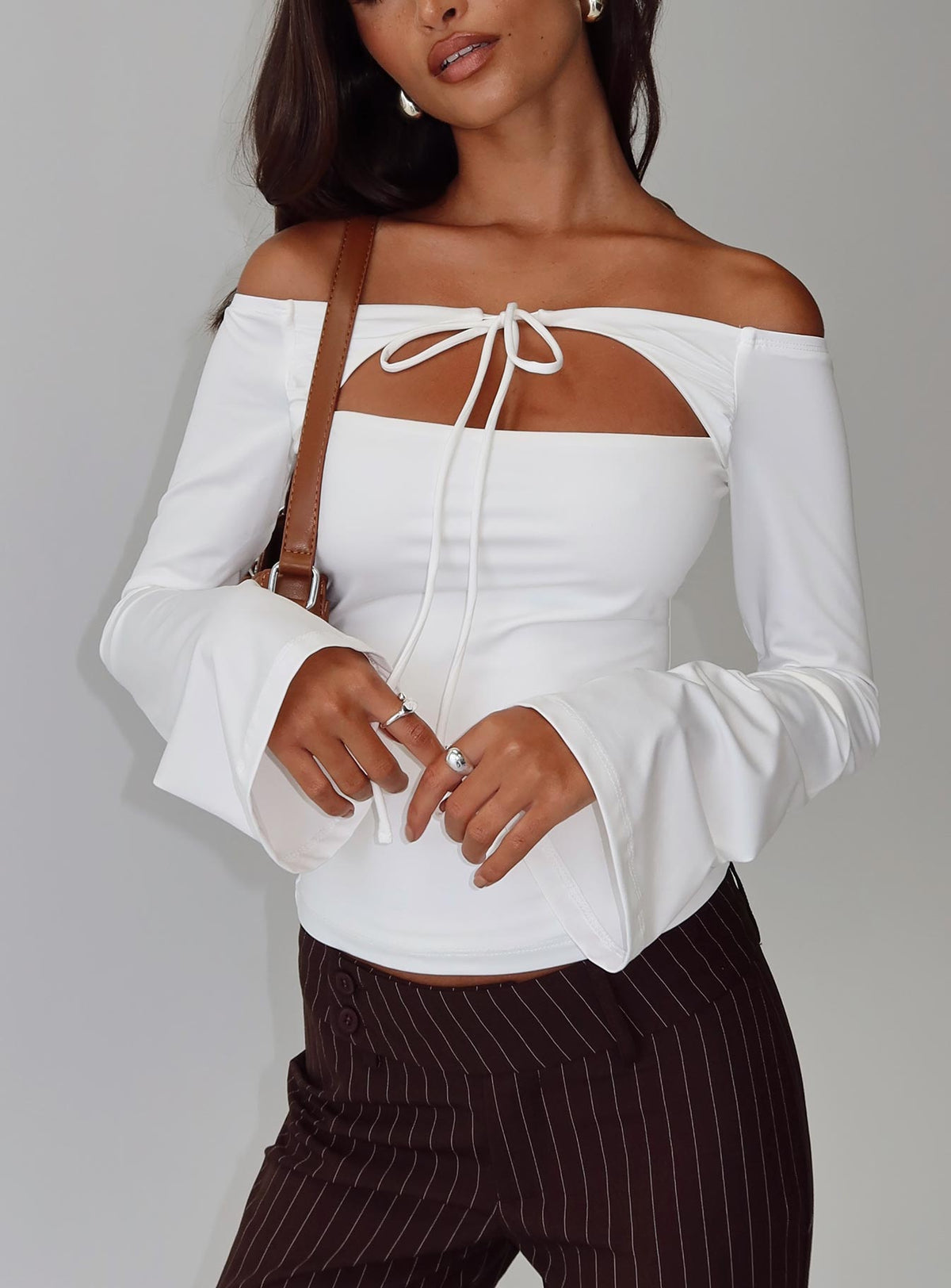 front view of model wearing Princess Polly Nevah Long Sleeve Top White Full Sleeves straight 