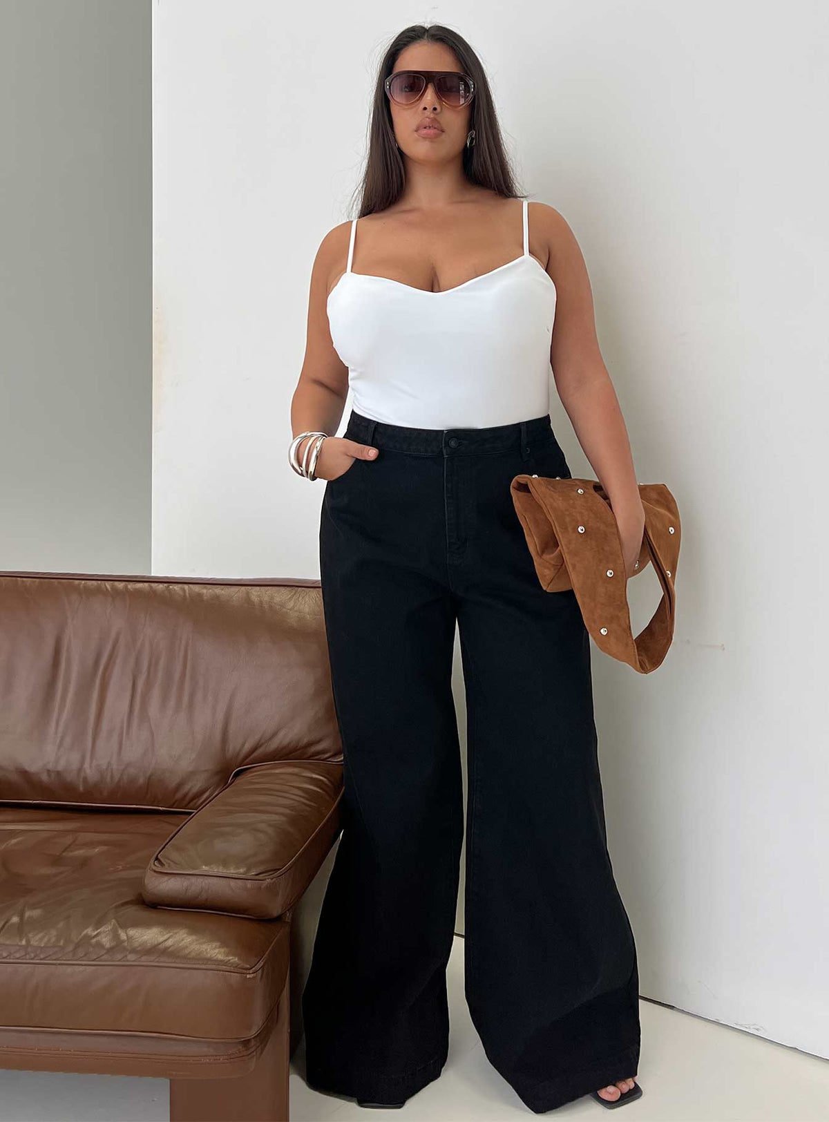 front view of model wearing Princess Polly Goldie High Wide Jean True Black Curve High Waisted 