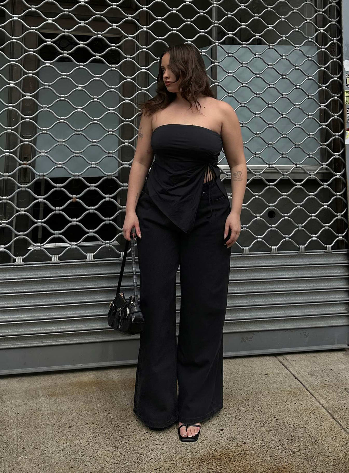front view of model wearing Princess Polly Naylor Wide Leg Jeans Washed Black Denim Petite High Waisted 