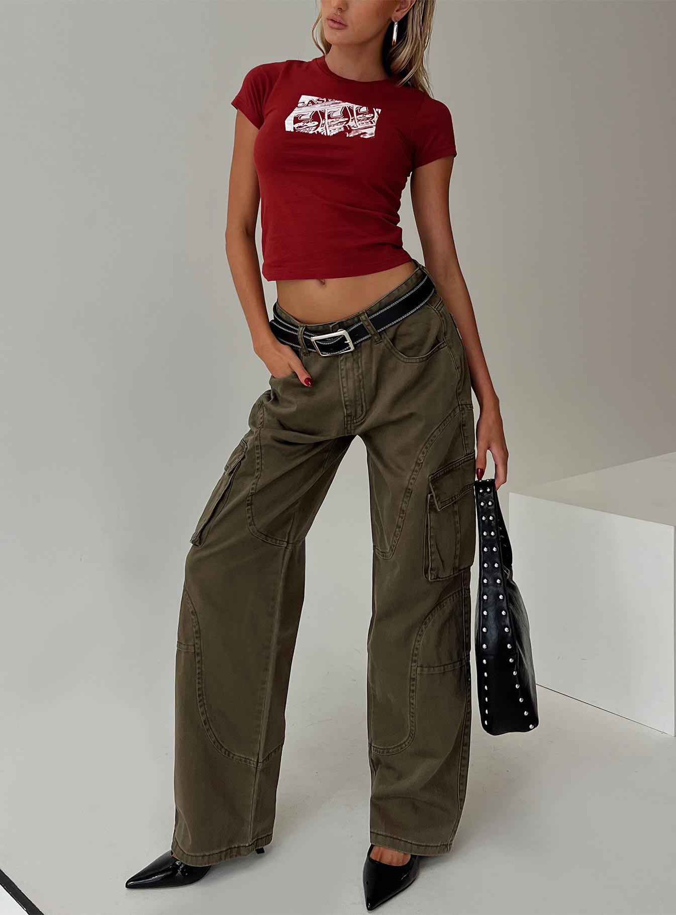front view of model wearing Princess Polly Ahstin Cargo Jeans Green Low Rise Jeans 