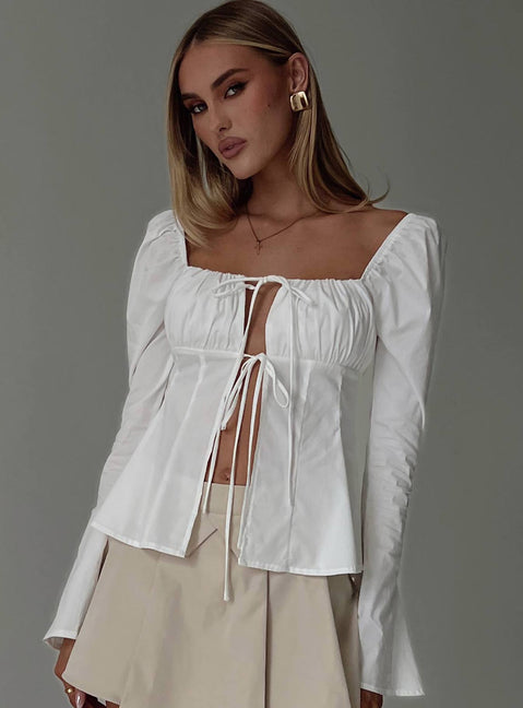 front view of model wearing Princess Polly Lilibette Tie Up Long Sleeve Top White Full Sleeves Square Neck 