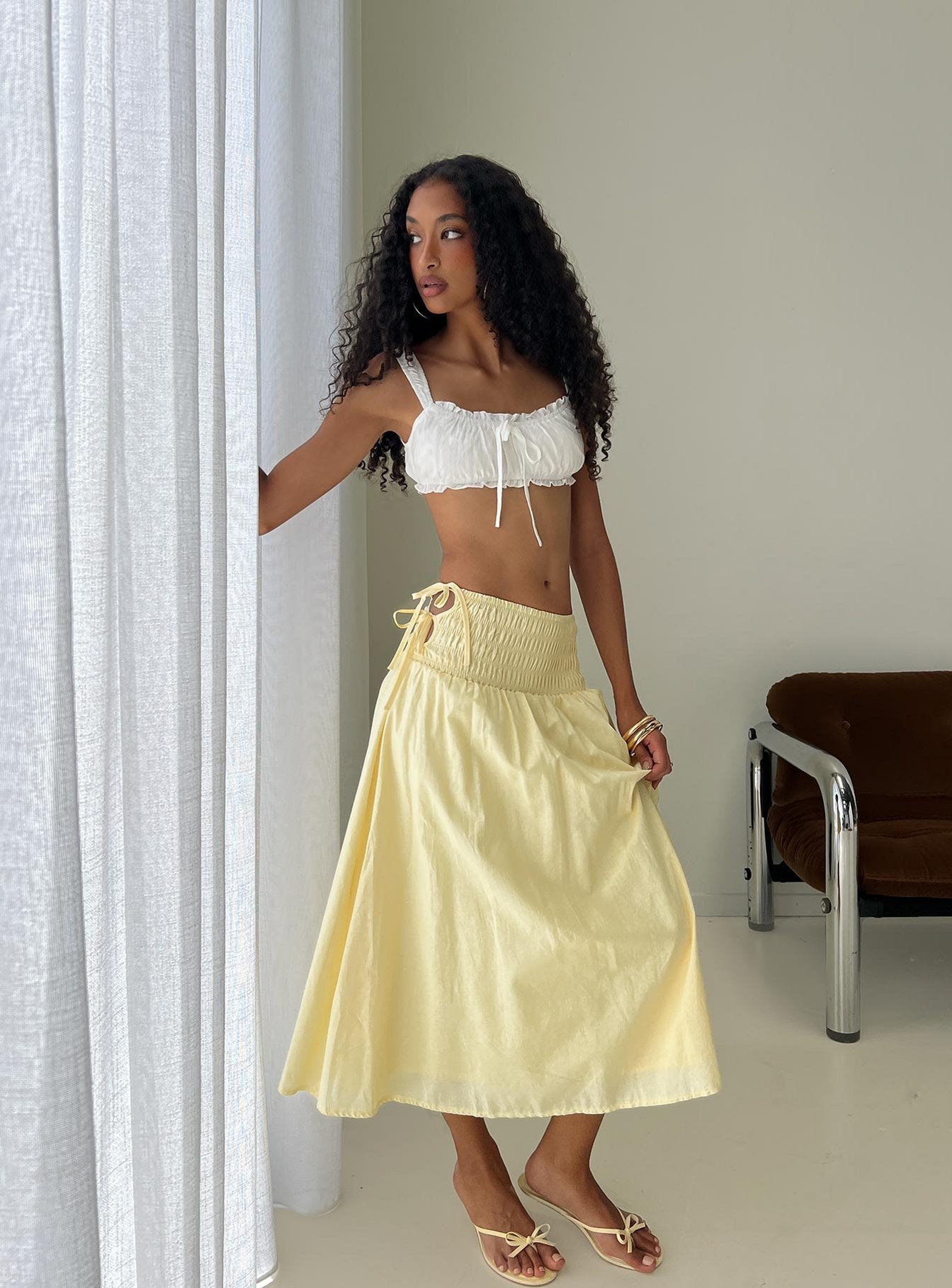 back view of model wearing Princess Polly Vence Ruched Maxi Skirt Lemon Yellow Maxi Skirts 
