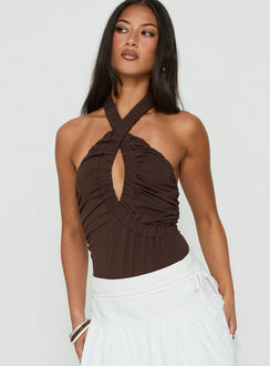Showcasing the Pettra Halter Neck Bodysuit Brown womens-bodysuit with sleeveless design front view of model wearing Princess Polly