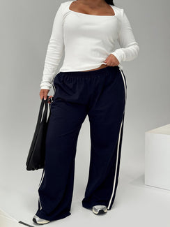 front view of model wearing Princess Polly Circuit Track Pants Navy Curve Pants 