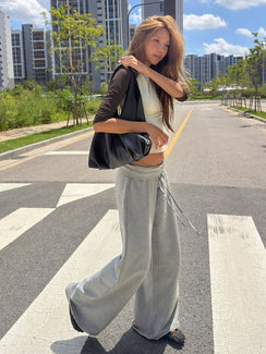 Explore the Dodie Wide Leg Pants Dark Grey Marle in womens regular pants with mid-rise waist side view of model wearing Princess Polly