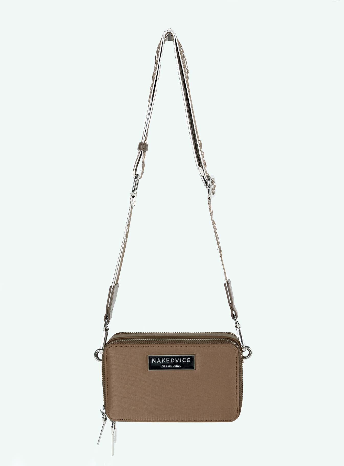 Crossbody bag Faux leather trims Adjustable and removable strap Two separate compartments Zip fastening Silver toned hardware Branded plaque at front Flat base