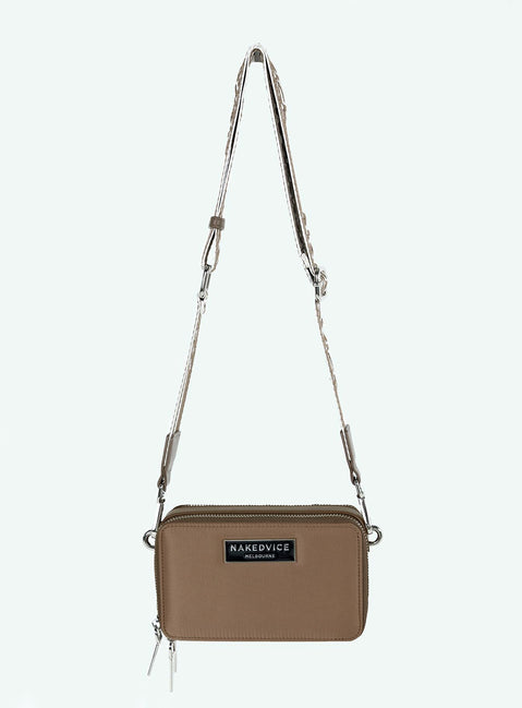 Crossbody bag Faux leather trims Adjustable and removable strap Two separate compartments Zip fastening Silver toned hardware Branded plaque at front Flat base