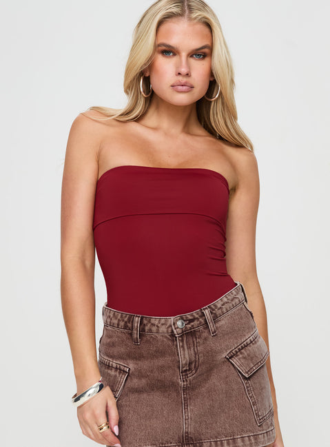 front view of model wearing Princess Polly Niner Strapless Bodysuit Burgundy Petite Sleeveless Bodysuit 
