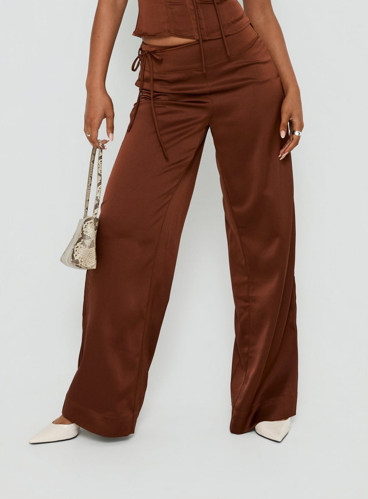 Crafted from Aubrette Satin Tie Pants Chocolate womens-regular-pants featuring high-rise wide-leg silhouette detail Princess Polly