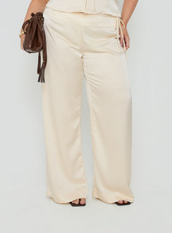 Showcasing the Aubrette Satin Tie Pants Cream Curve womens-regular-pants with high-rise, belt detail and wide-leg cut detail Princess Polly