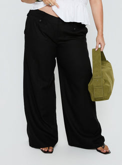 side view of model wearing Princess Polly Pedra Wide Leg Pant Black Curve Mid Rise Pants 