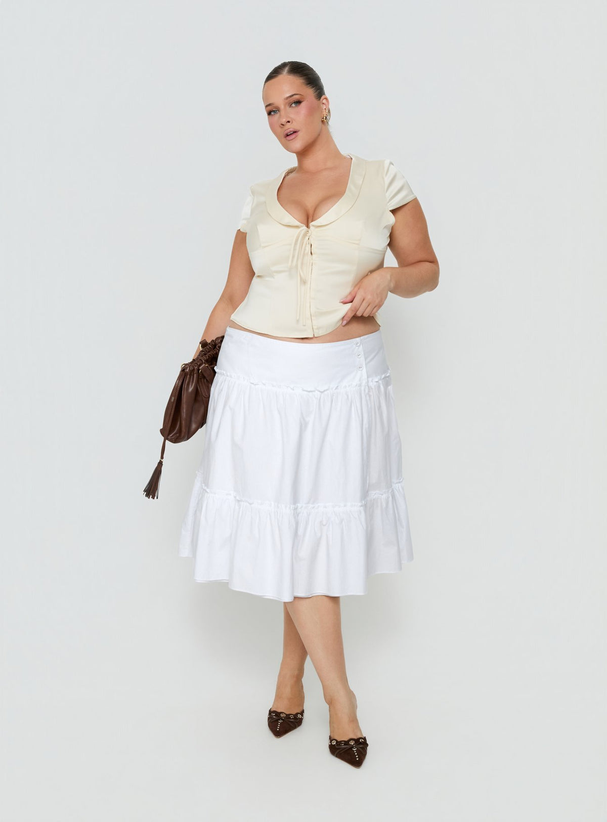 Featuring the Cascades Low Rise Midi Skirt White Curve in womens-skirts with midi length detail view of model wearing