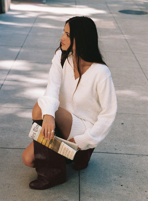 side view of model wearing Princess Polly Fine Line Long Sleeve Knit Mini Dress White V-Neck 