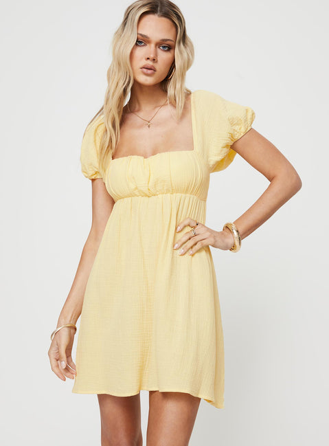 Front view of model wearing  front Princess Polly Square Neck  Let's Dance Mini Dress Yellow