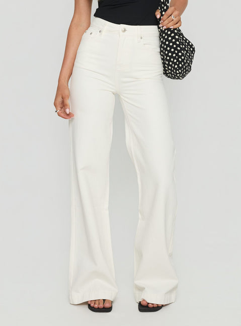 side view of model wearing Princess Polly Goldie High Rise Wide Leg Jeans White High Rise Jeans 