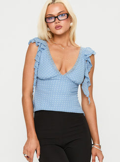 front view of model wearing Princess Polly Miztry Top Blue Polka Sleeveless Plunger 