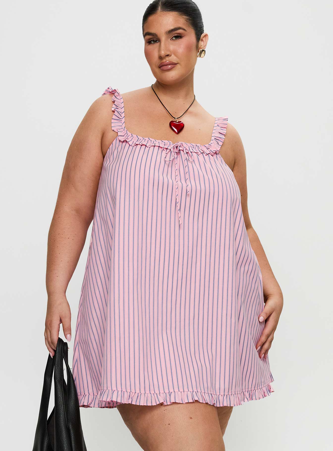 side view of model wearing Princess Polly Zalina Babydoll Mini Dress Pink Stripe Curve Square Neck 