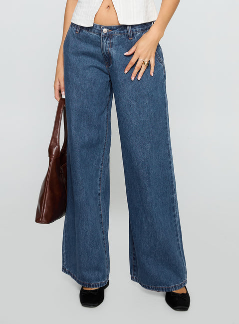 side view of model wearing Princess Polly Hyde Baggy Jeans Mid Blue Low Rise Jeans 