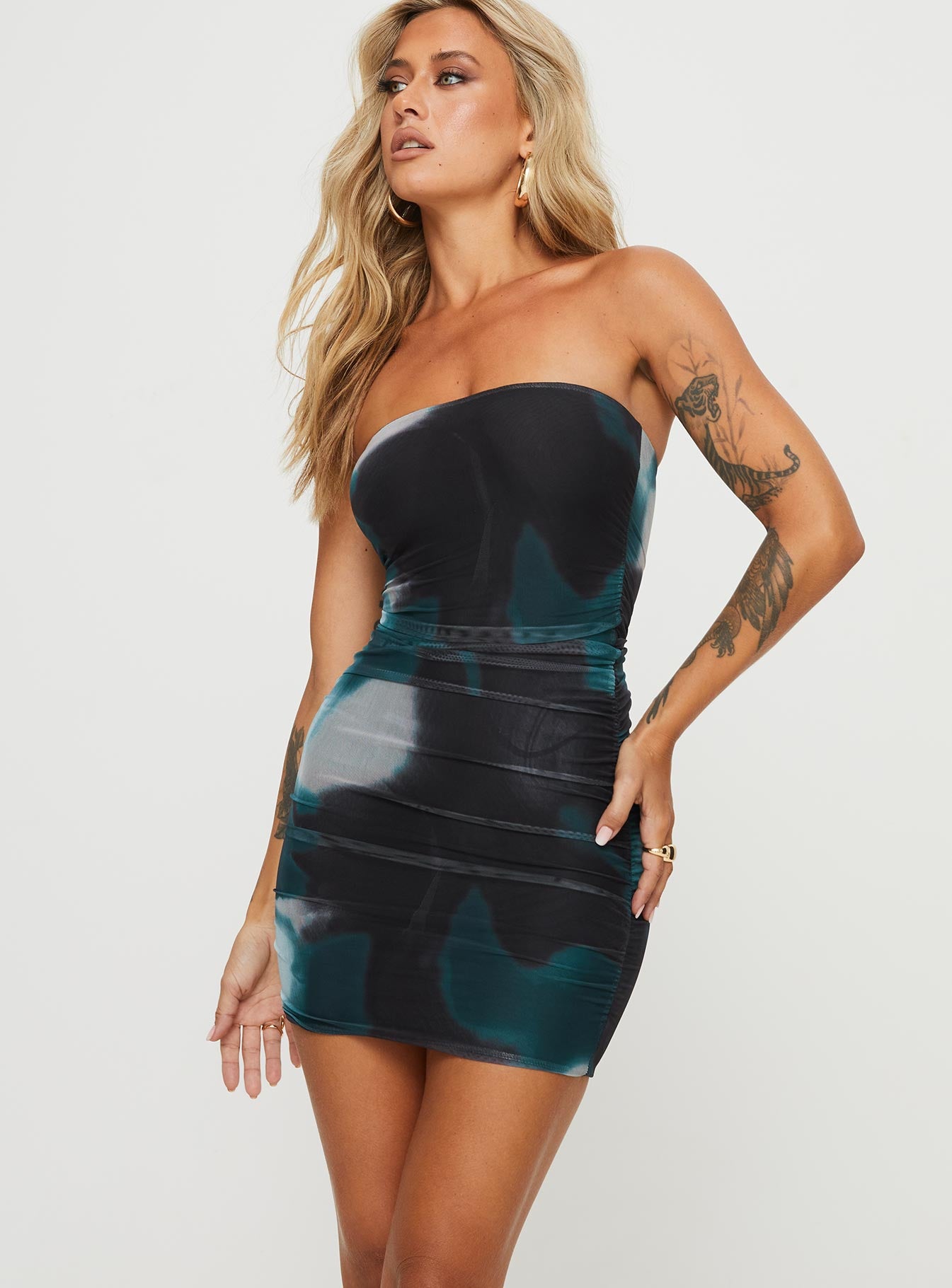 side view of model wearing Princess Polly Micah Mini Dress Navy Multi Petite Straight Neck 