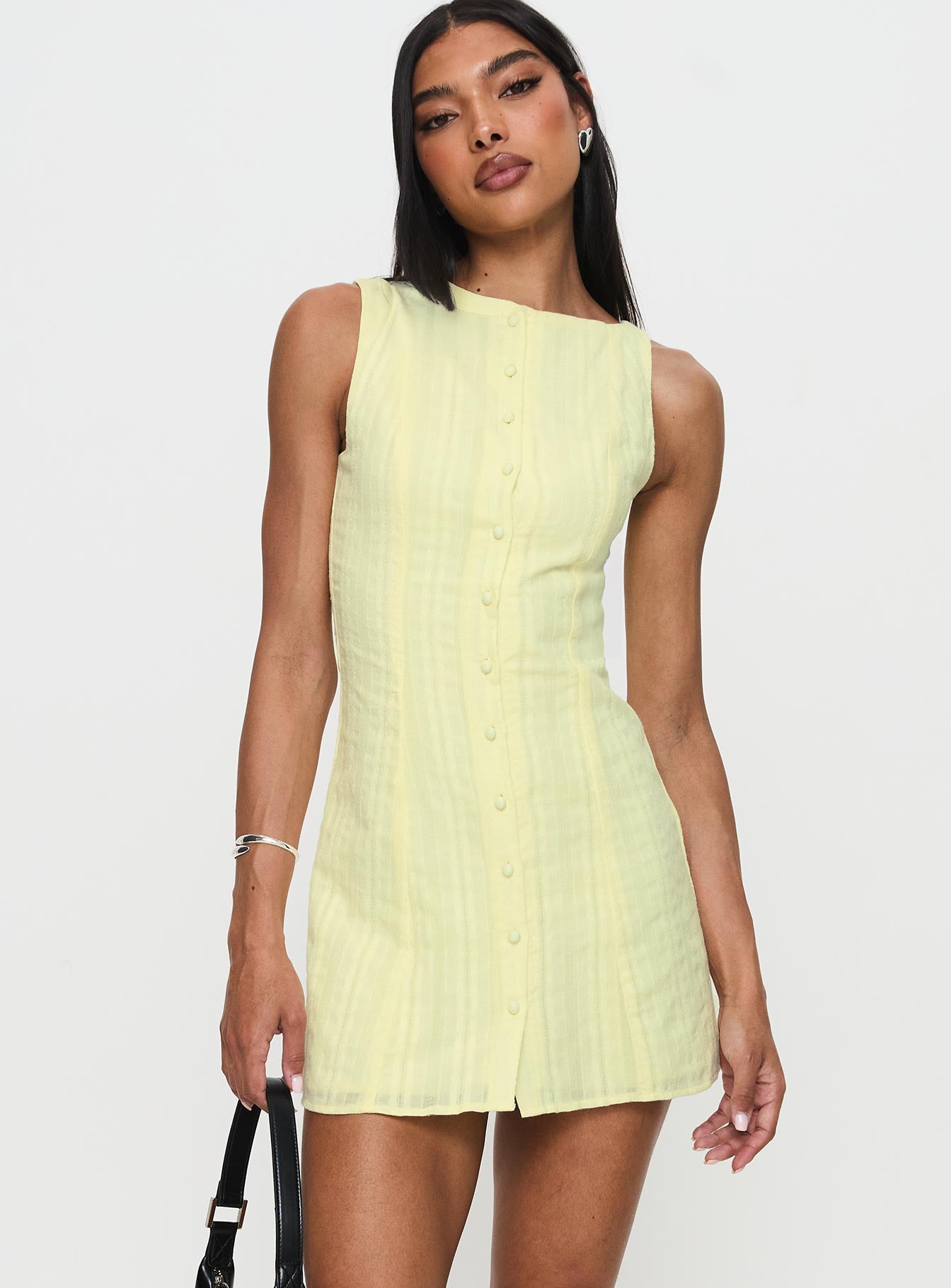 side view of model wearing Princess Polly Mimsie Embroidered Mini Dress Lemon Boat Neck 