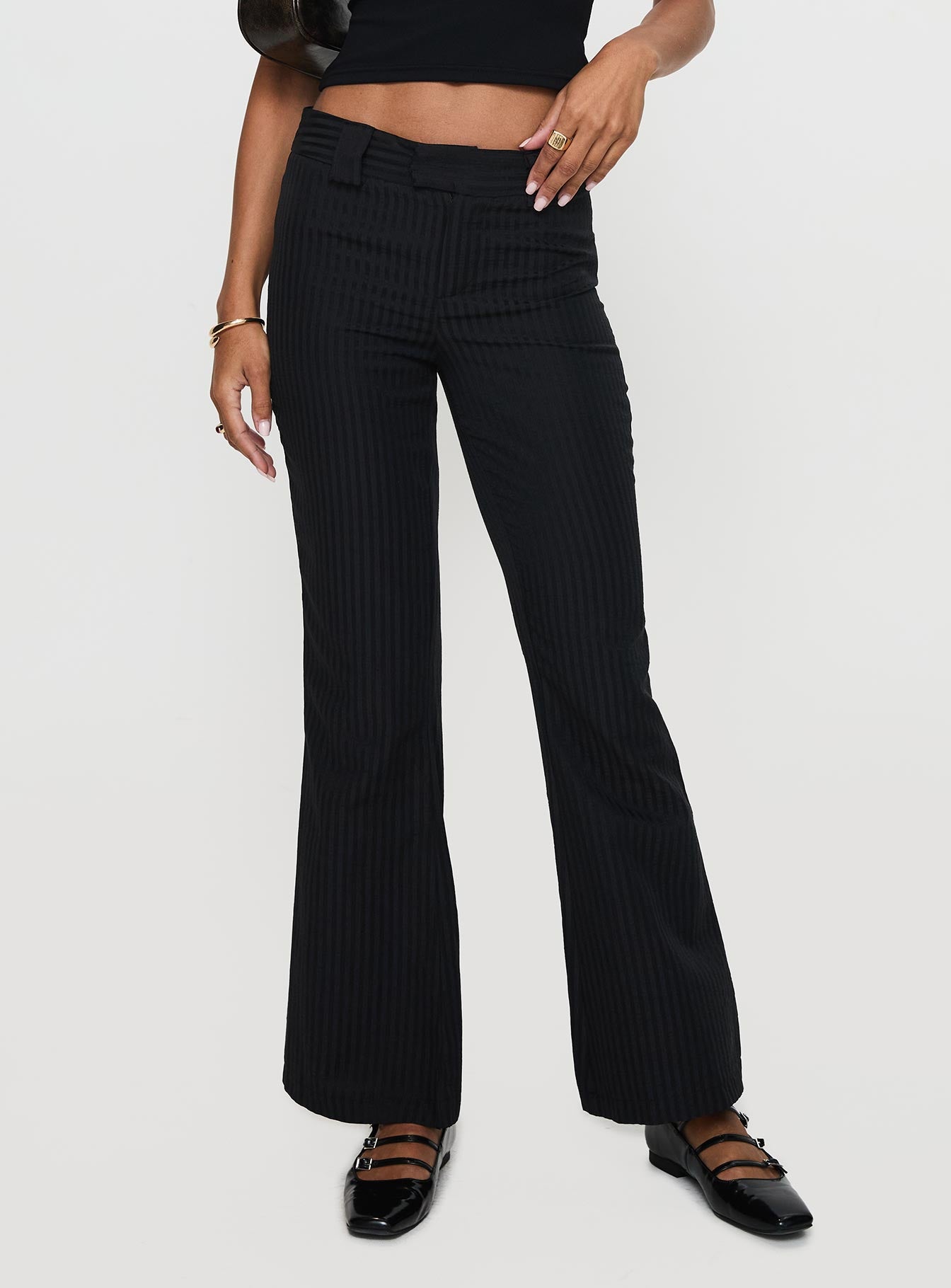 side view of model wearing Princess Polly Jinxed Pant Black Low Rise Pants Pants 