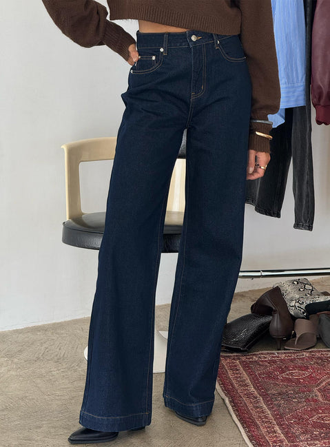 back view of model wearing Princess Polly Goldie High Rise Wide Leg Jeans Indigo High Rise Jeans 