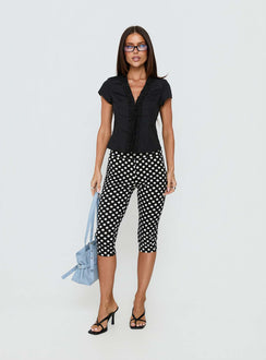 front view of model wearing Princess Polly Isadonna Capri Pants Black Polka Dot Mid Rise Pants 