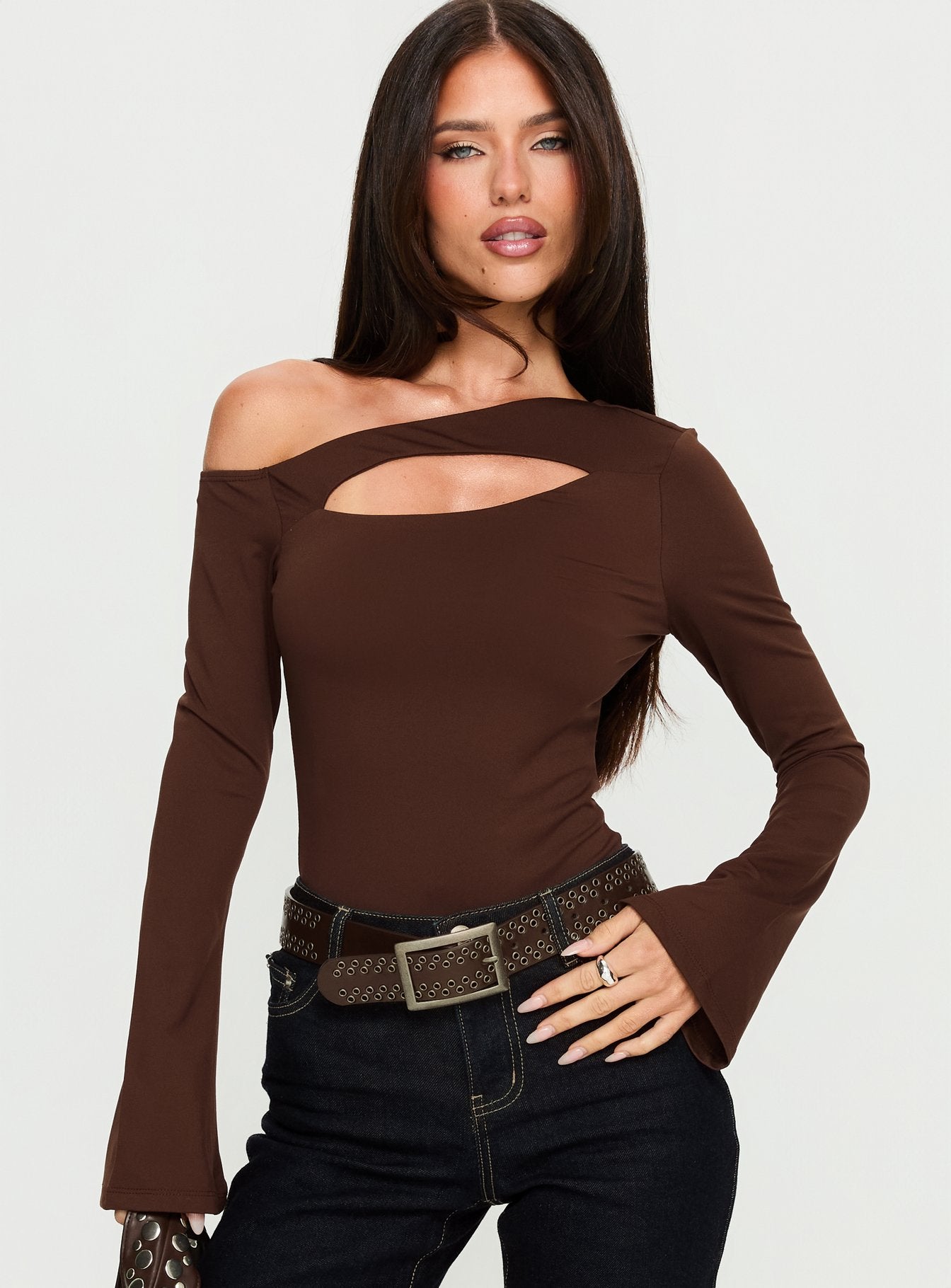 front view of model wearing Princess Polly Raissa Cut Out One Shoulder Bodysuit Brown Long Sleeve Tops 