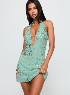 side view of model wearing Princess Polly Telenova Halter Mini Dress Green Plunger 