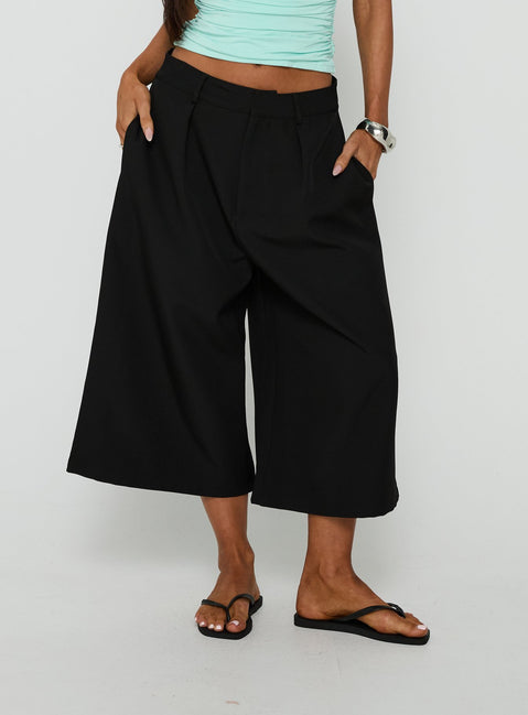 Featuring the Busy Busy Low Baggy Capri Pant Black in womens-regular-pants with low-rise product Princess Polly