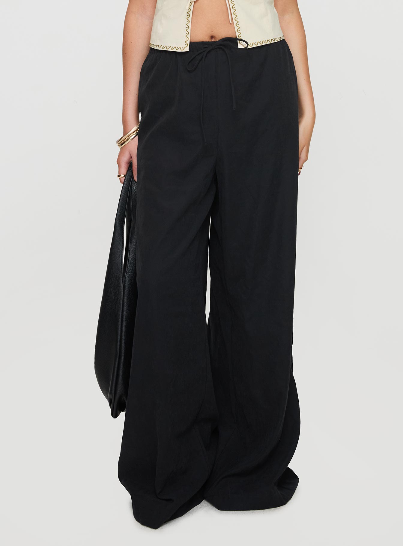 side view of model wearing Princess Polly Barbieri Pants Black High Waisted Pants 