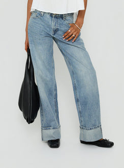 Presenting the Serenitia Mid Rise Relaxed Cuff Jeans Light Vintage Wash womens-jeans with mid-rise waist detail view of model wearing Princess Polly