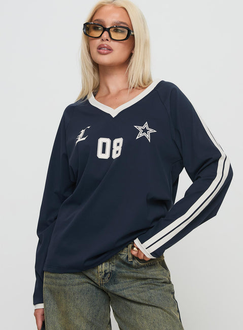front view of model wearing Princess Polly Spectate Top Long Sleeve Navy Full Sleeves V-Neck 